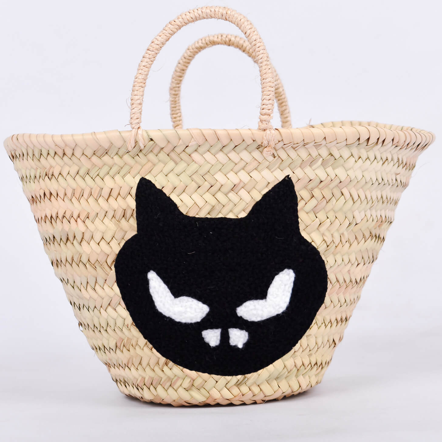 Personalized straw basket with your child's name for Halloween.