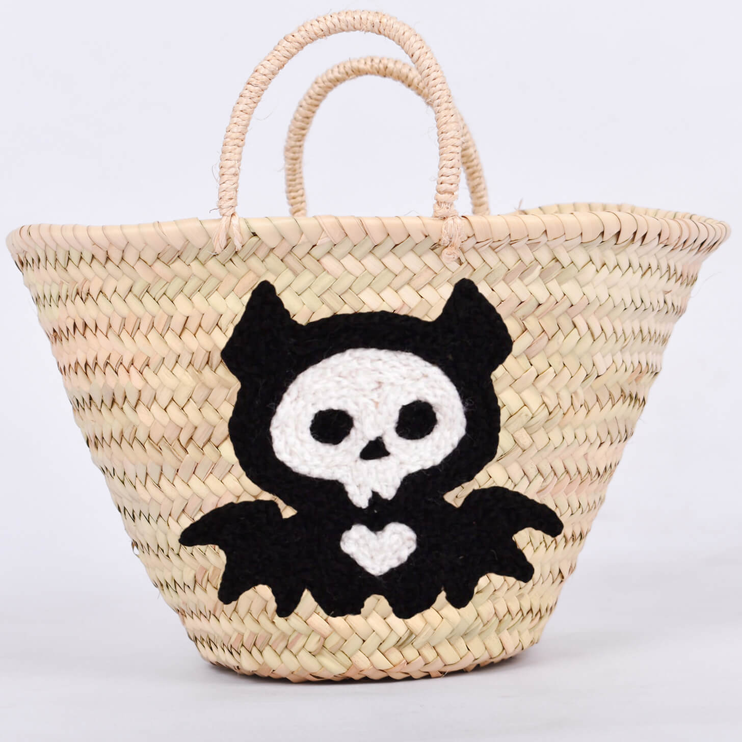 Personalized straw basket with your child's name for Halloween.