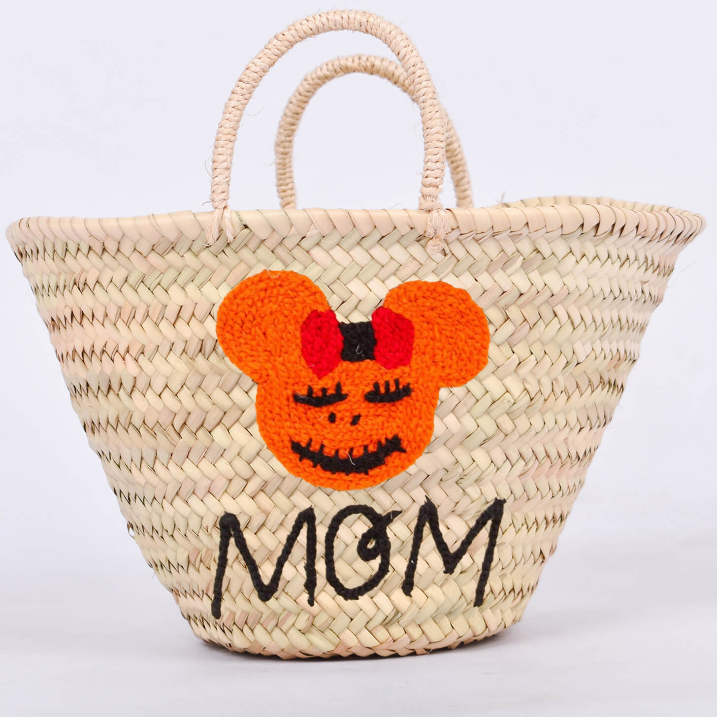 Personalized straw basket with your child's name for Halloween.