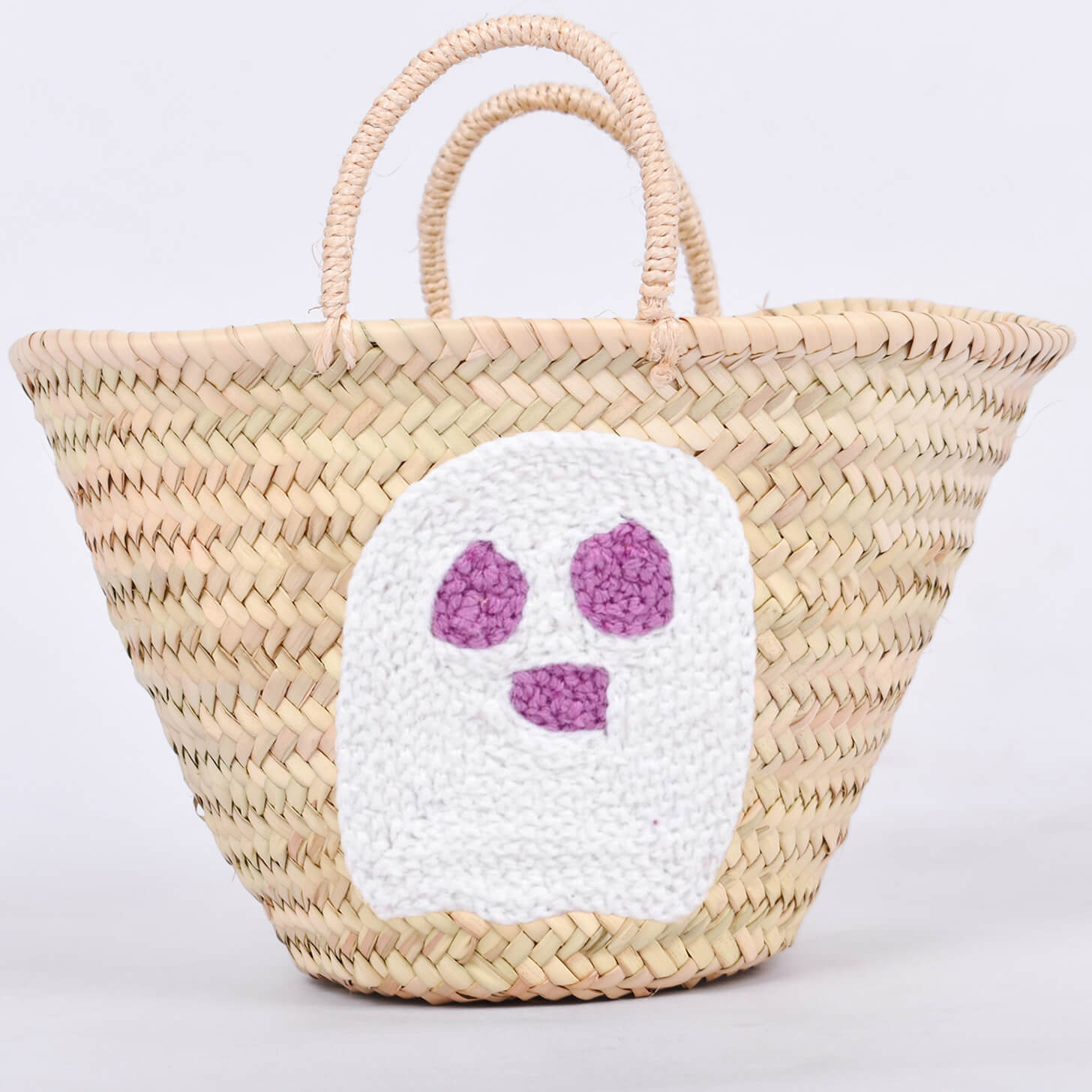 Personalized straw basket with your child's name for Halloween.