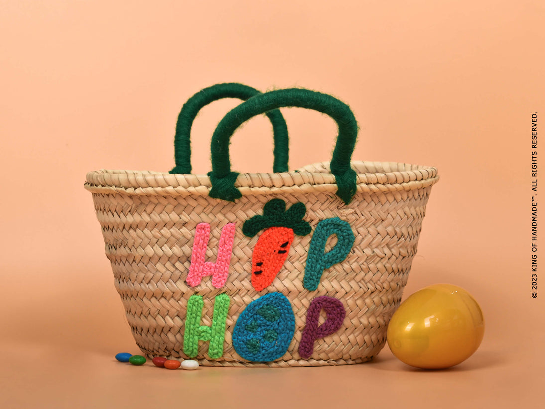 A personalized Easter basket filled with treats, toys, and decorations.