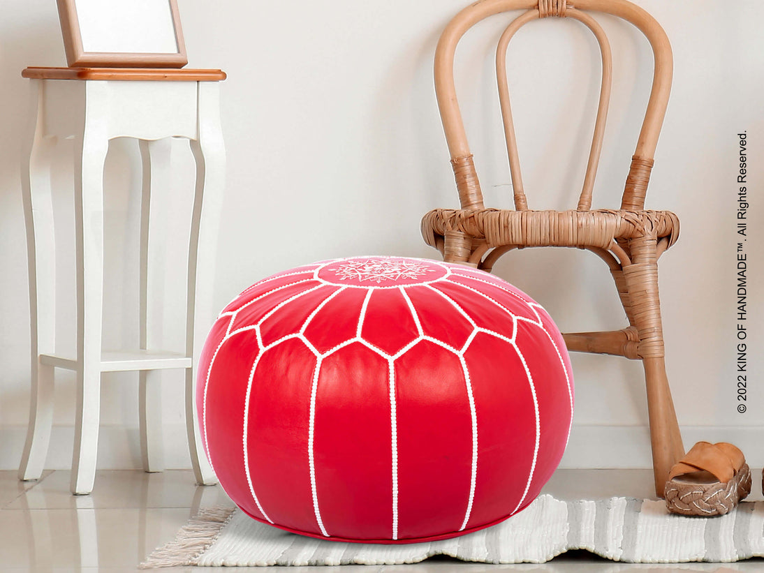 Vibrant red Moroccan pouf ottoman showcasing traditional embroidery and luxurious leather craftsmanship