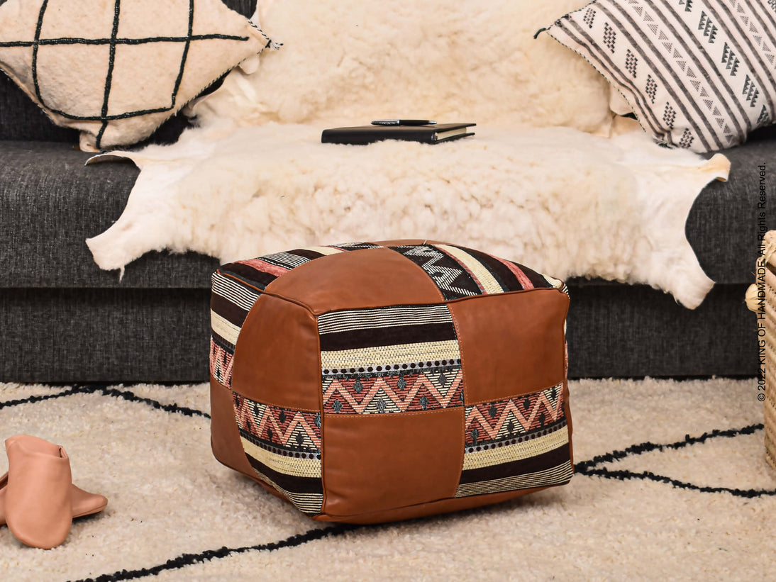 Handcrafted Moroccan Leather Pouf Ottoman in a stylish living room