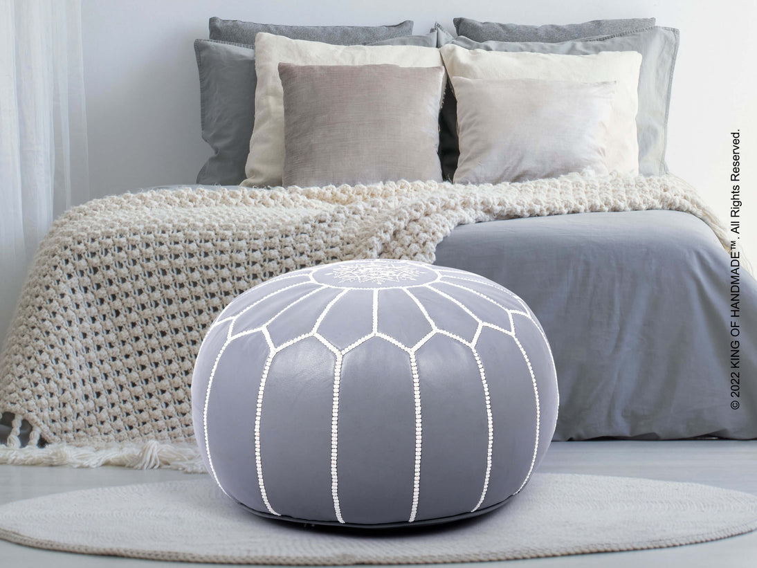 Gray Moroccan Ottoman Pouf in a living room setting