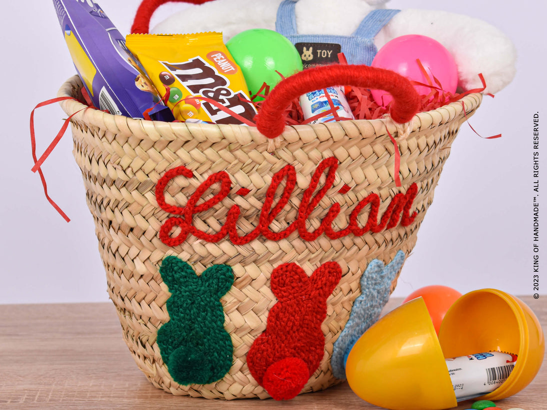 Handwoven straw Easter basket with a handle, featuring a colorful felt lining and embroidered with the recipient's name